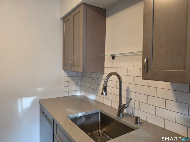 a close view of a sink and a faucet in a kitchen