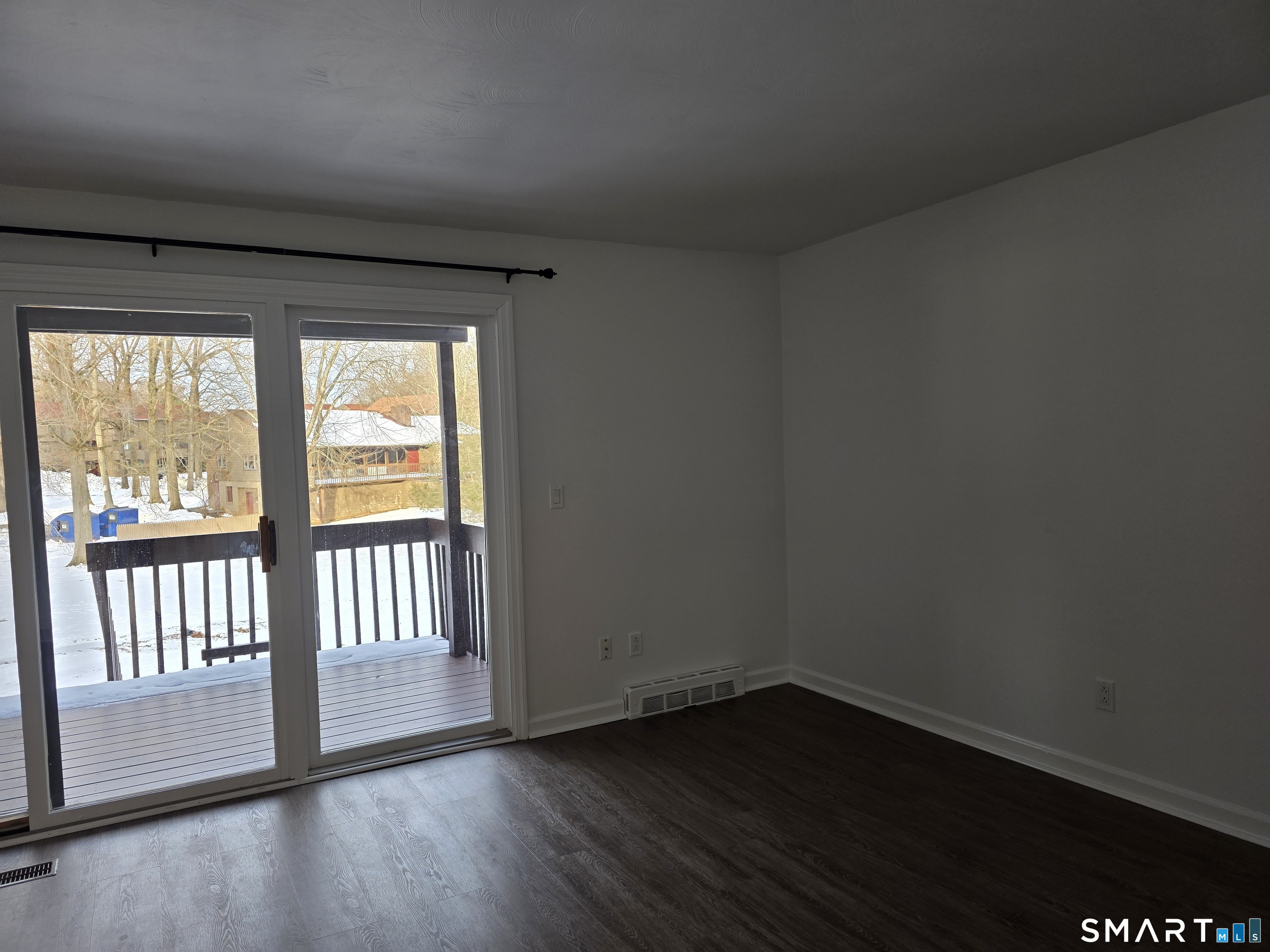45 Towne House Road, Unit 45 Hamden, CT 06514 - Photo 10 of 23 a view of wooden floor and windows in a room