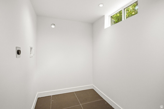 1187 East Ridgedale Circle Millcreek, UT 84106 - Photo 27 of 49 Dedicated laundry area featuring modern floor tiling, a high transom window, and recessed ceiling lighting