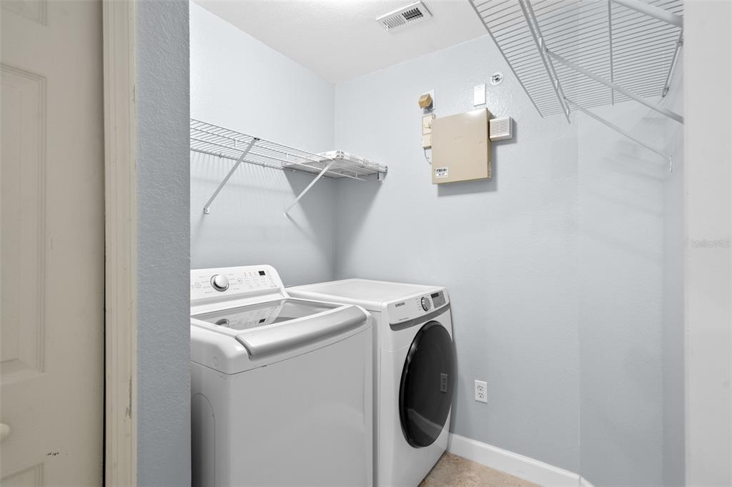 5459 Vineland Road, Unit 4302 Orlando, FL 32811 - Photo 18 of 25 a utility room with dryer and washer
