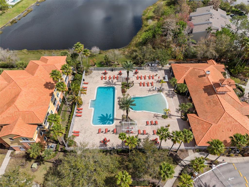 5459 Vineland Road, Unit 4302 Orlando, FL 32811 - Photo 20 of 25 an aerial view of a house with a yard and garden