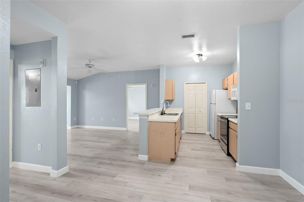 5459 Vineland Road, Unit 4302 Orlando, FL 32811 - Photo 4 of 25 a view of a kitchen cabinets and wooden floor