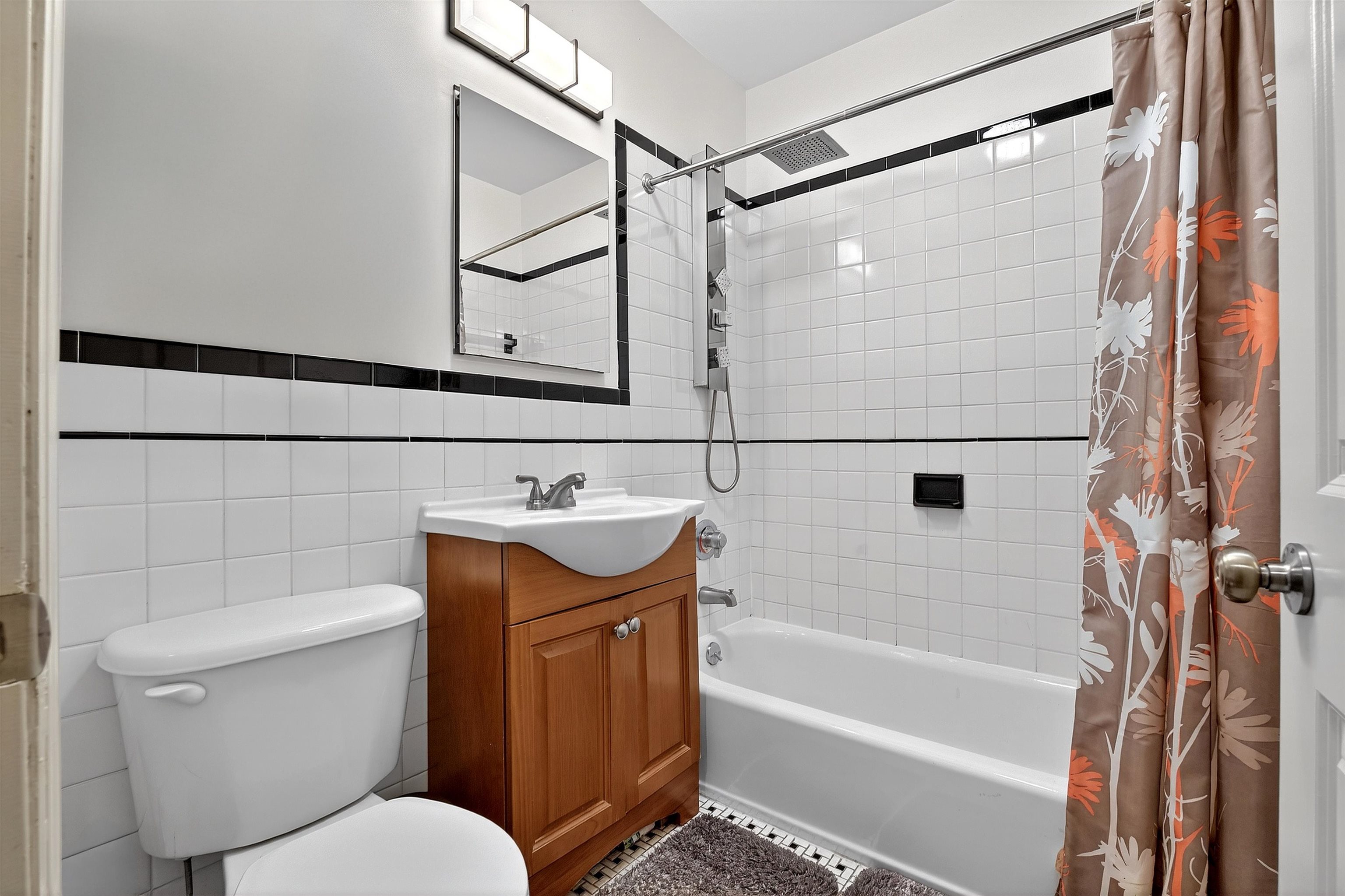 46 Mercer Street, Unit 2 Jersey City, NJ 07302 - Photo 11 of 17 a bathroom with a toilet sink and shower