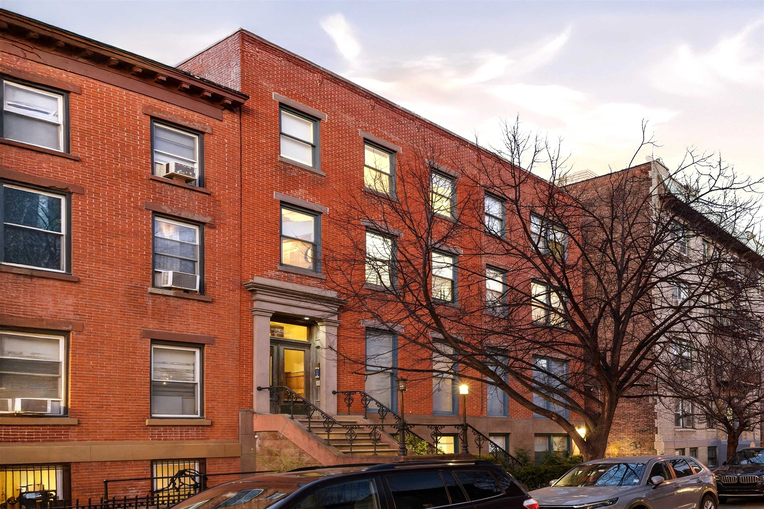 46 Mercer Street, Unit 2 Jersey City, NJ 07302 - Photo 16 of 17 a large building with a lot of windows