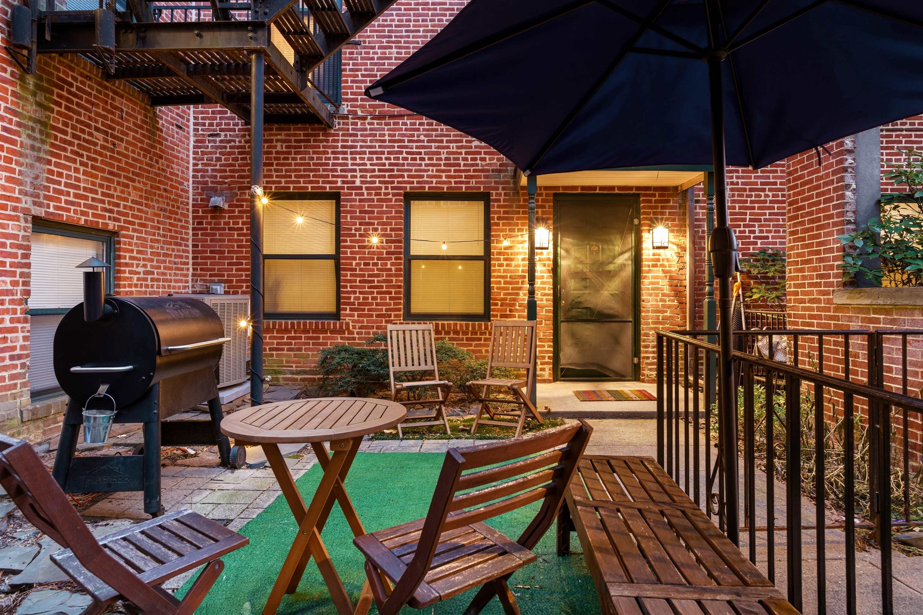 46 Mercer Street, Unit 2 Jersey City, NJ 07302 - Photo 2 of 17 a view of a chairs and table in the patio