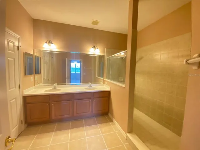 a view of a bathroom from a hallway