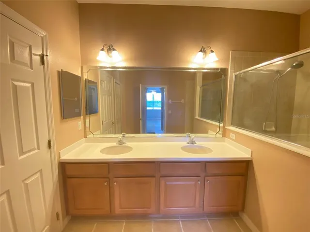 a bathroom with a tub and a shower