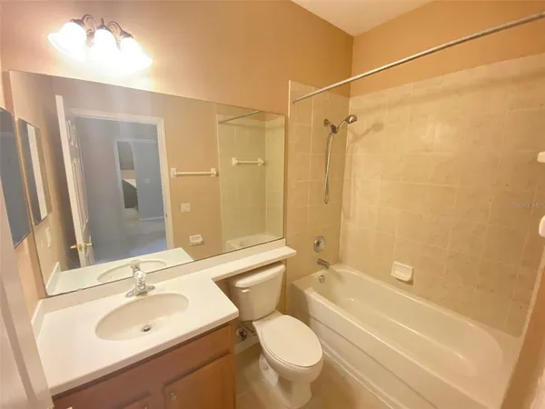 a bathroom with a double vanity sink a mirror and a