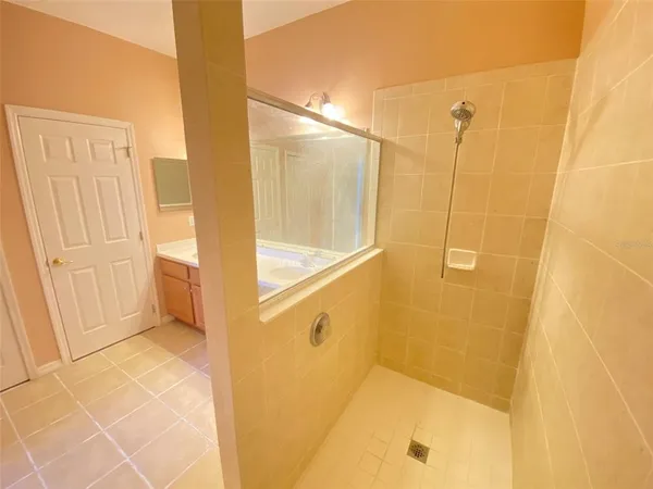 a white toilet sitting next to a white wall