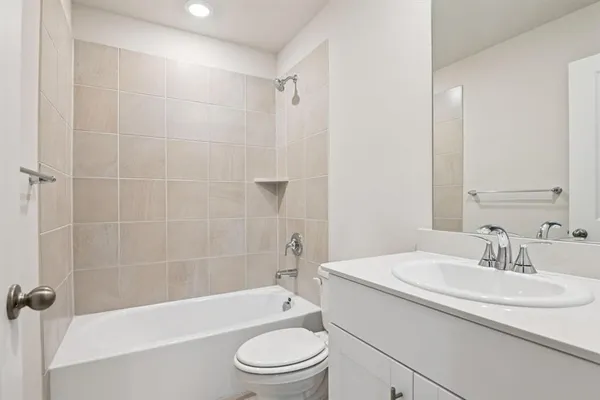 a bathroom with a sink a toilet and a bathtub