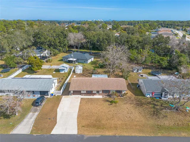 an aerial view of a house with a swimming pool