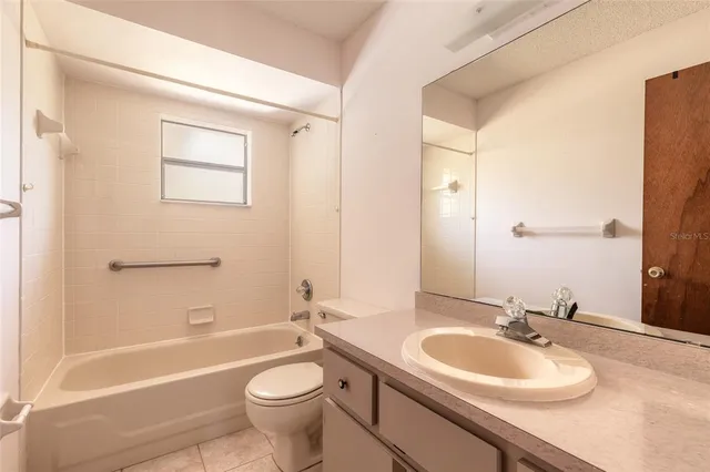 a bathroom with a sink a toilet and a bathtub
