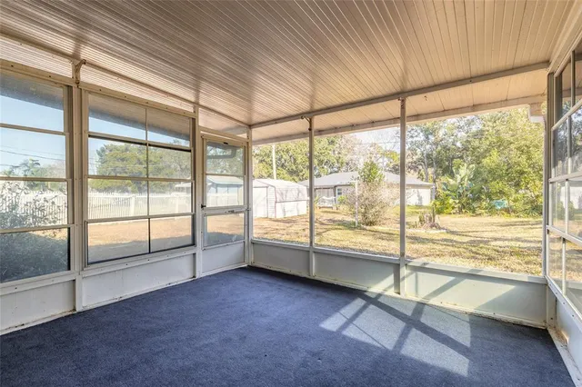 a view of an empty room and window