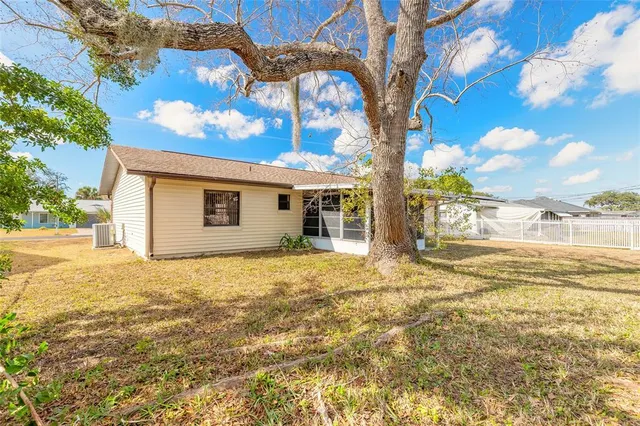 a view of a house with a yard and garage