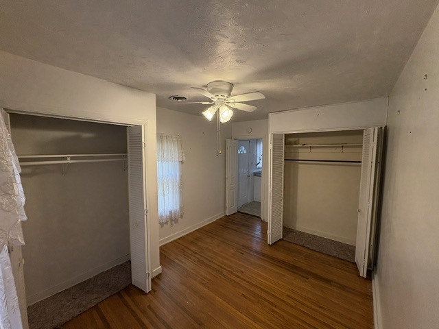 3S471 Pattermann Road Warrenville, IL 60555 - Photo 9 of 18 an empty room with wooden floor and a ceiling fan