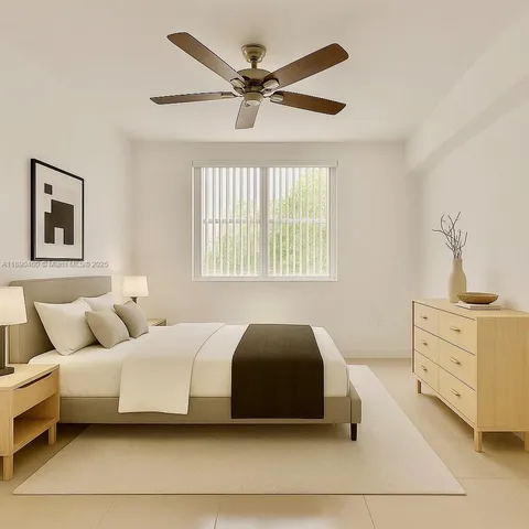 a bedroom with a bed and window