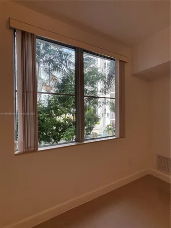 a view of a room that has a window in it