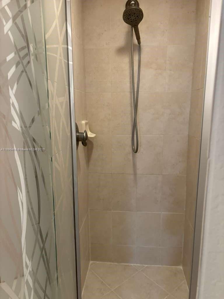 1830 Radius Drive, Unit 318 Hollywood, FL 33020 - Photo 18 of 47 a bathroom with a shower