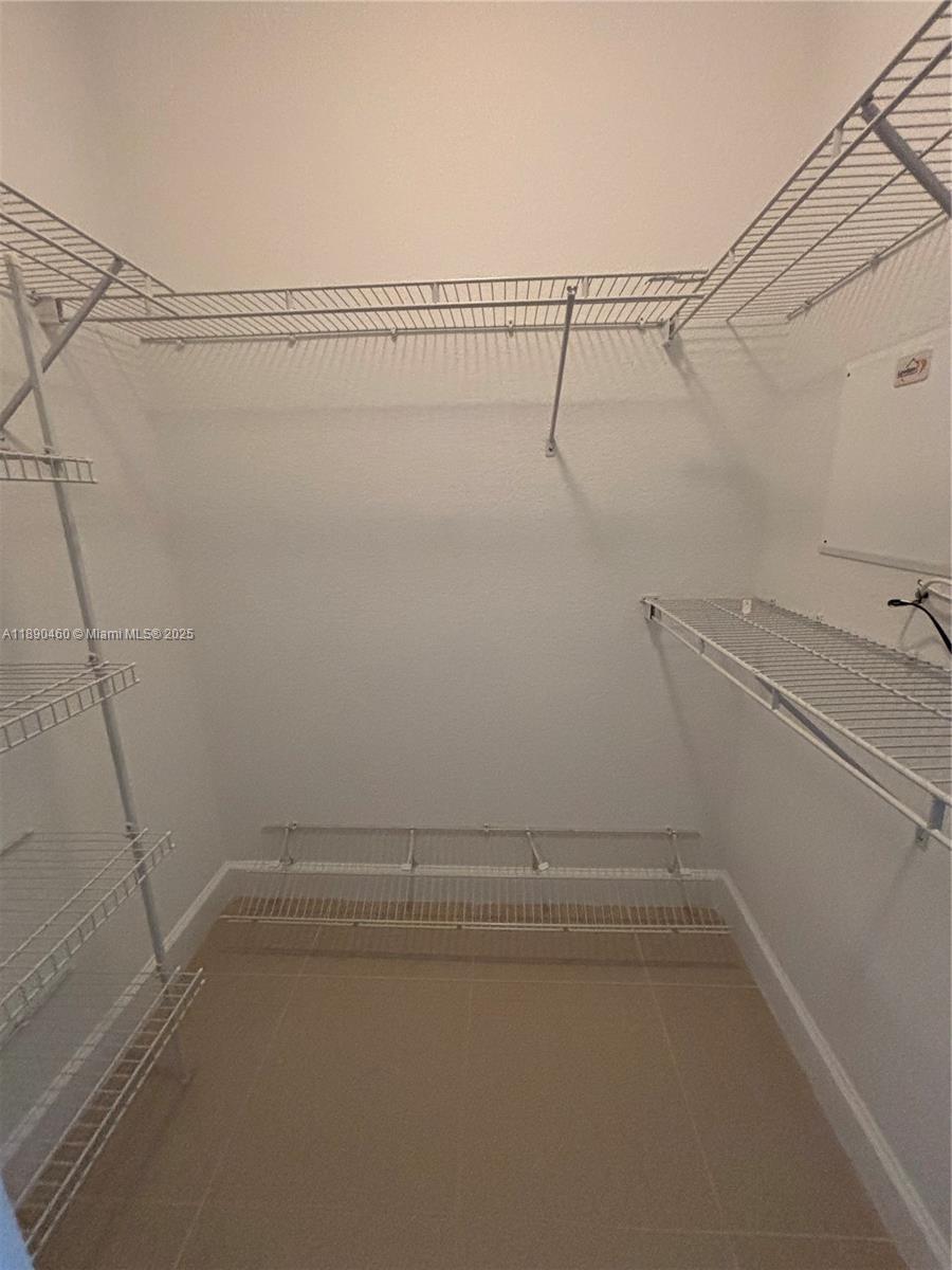 1830 Radius Drive, Unit 318 Hollywood, FL 33020 - Photo 21 of 47 a view of a room with racks on the wall