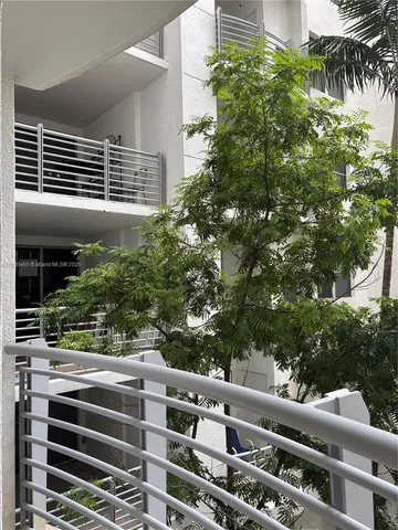 a view of a balcony with plants