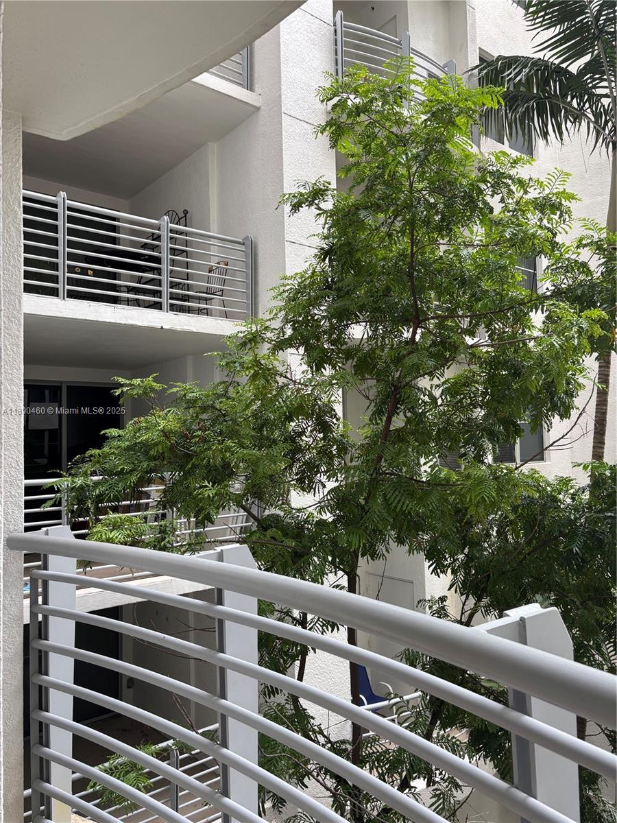 1830 Radius Drive, Unit 318 Hollywood, FL 33020 - Photo 4 of 47 a view of a balcony with plants