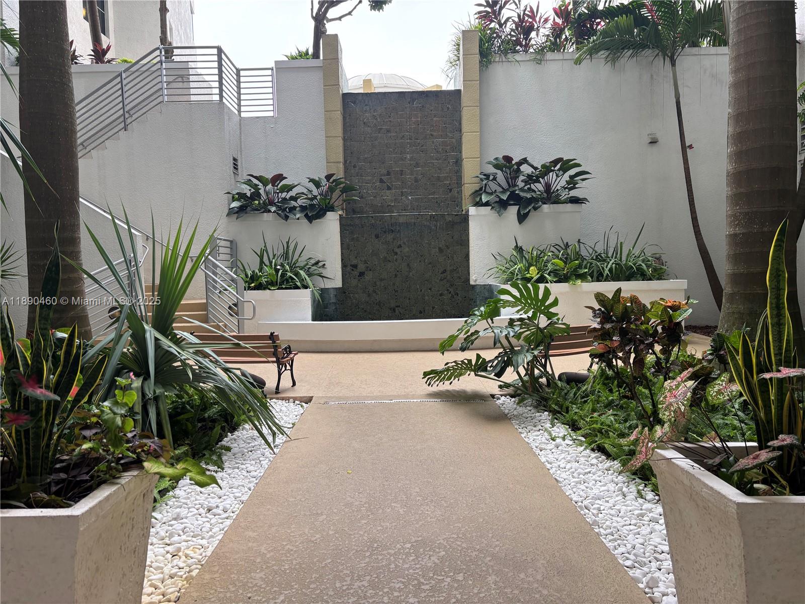 1830 Radius Drive, Unit 318 Hollywood, FL 33020 - Photo 42 of 47 a view of a terrace with plants