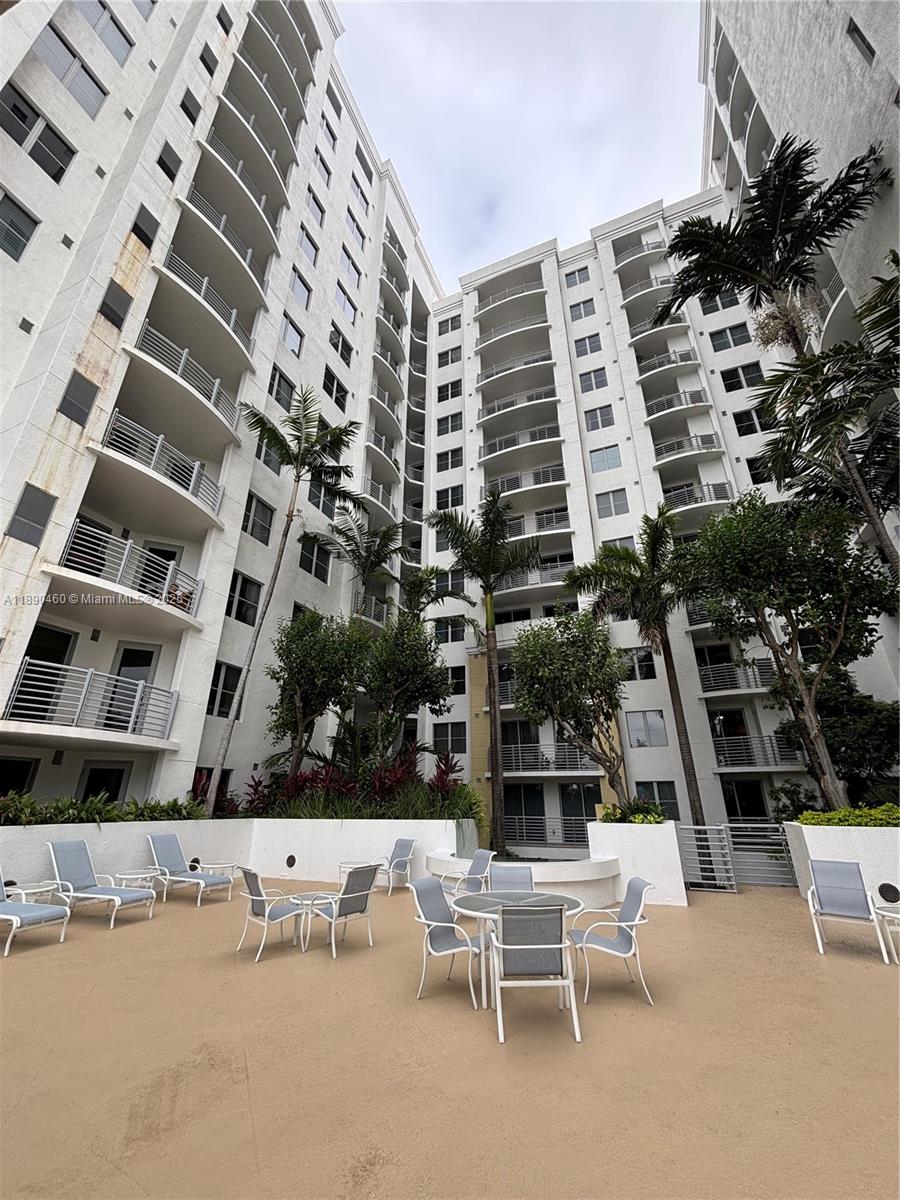 1830 Radius Drive, Unit 318 Hollywood, FL 33020 - Photo 45 of 47 a view of building with outdoor space