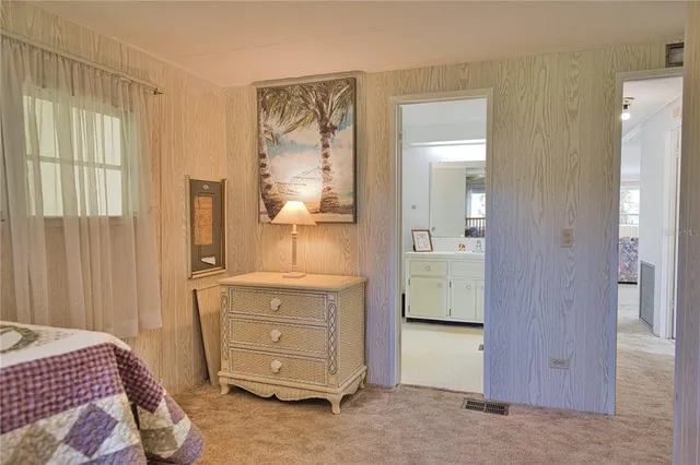 a view of a house with backyard porch and sitting area