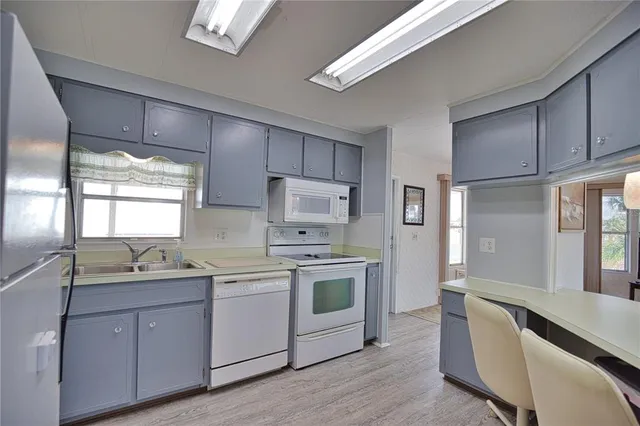 a open kitchen with white cabinets