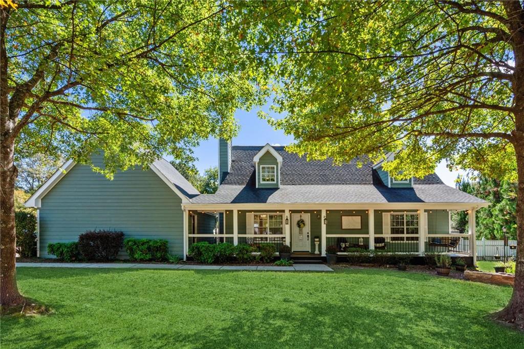 2355 Hickory Pointe Road Monroe, GA 30656 - Photo 1 of 1 a front view of a house with a garden