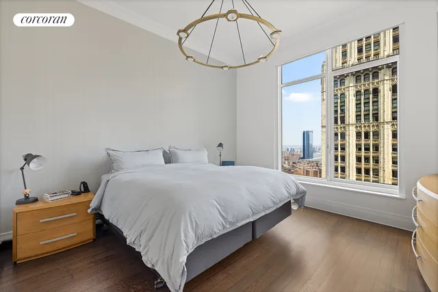 a living room with furniture and a book shelf
