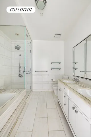 a kitchen with wooden floor and electronic appliances