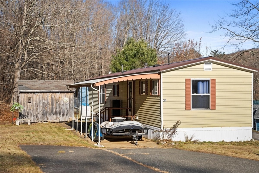 a couple of cars parked in front of a house