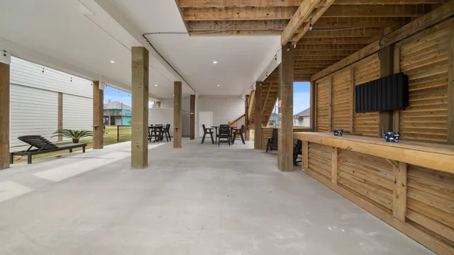 a lobby with furniture and a flat screen tv