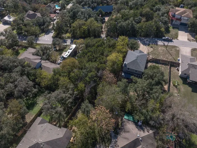 an aerial view of residential house with outdoor space