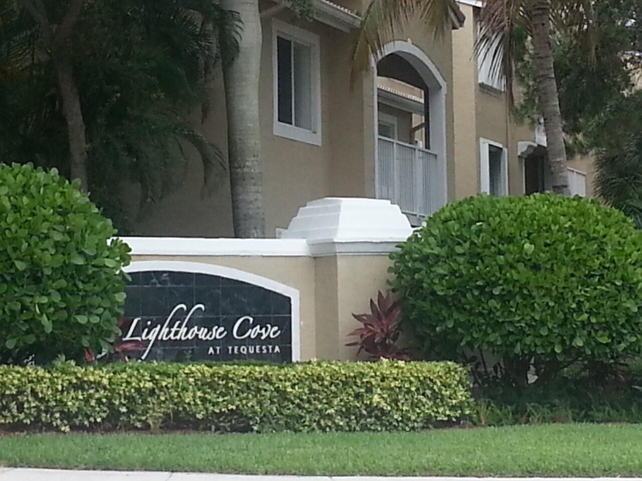 a view of front door and potted plants