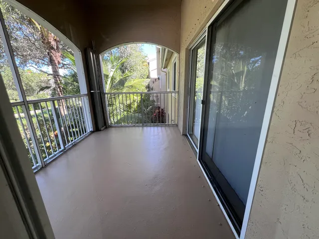 a view of a glass door with a porch