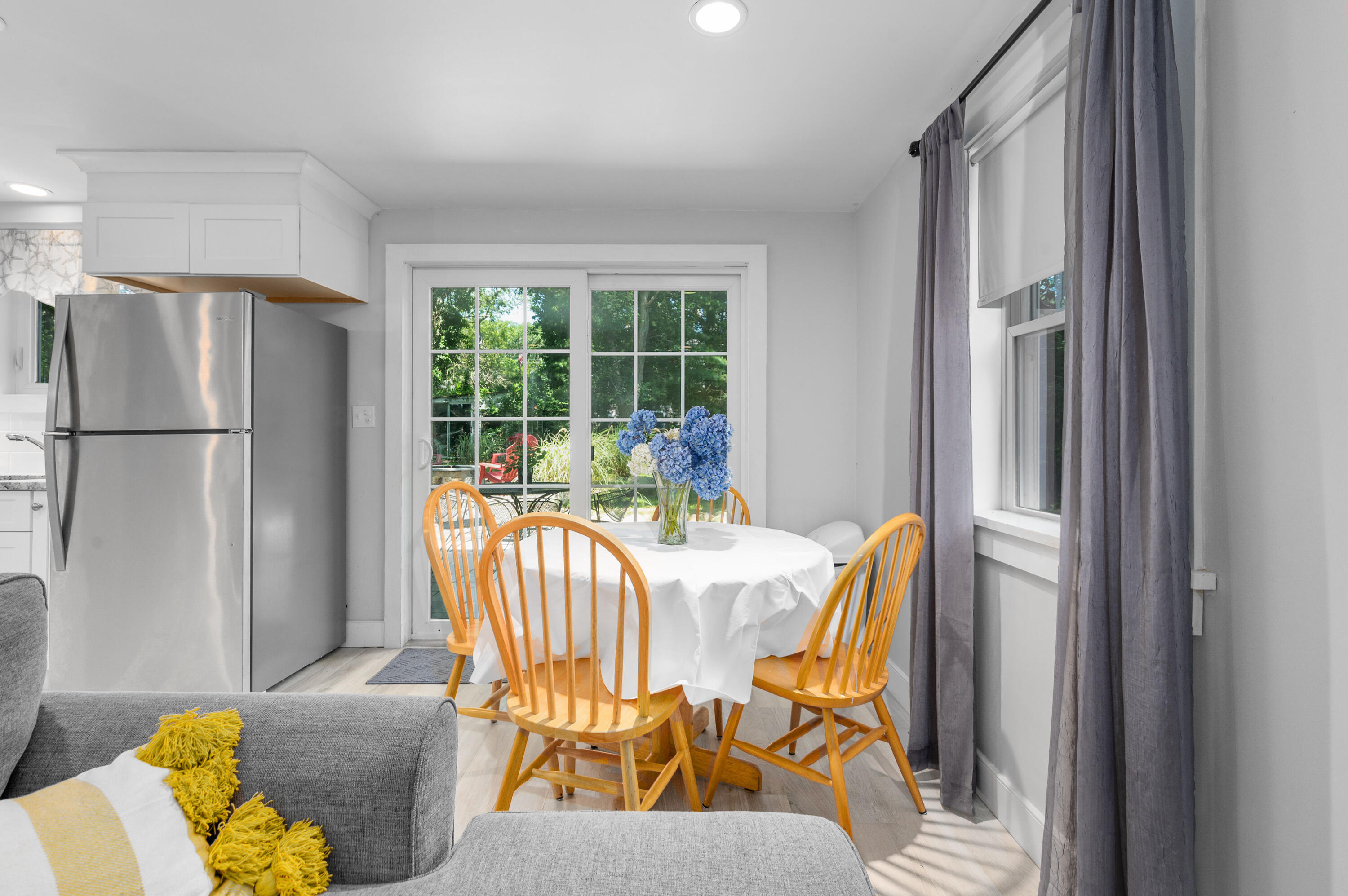 36 Riverside Road Mashpee, MA 02649 - Photo 13 of 48 a dining room with furniture and a window