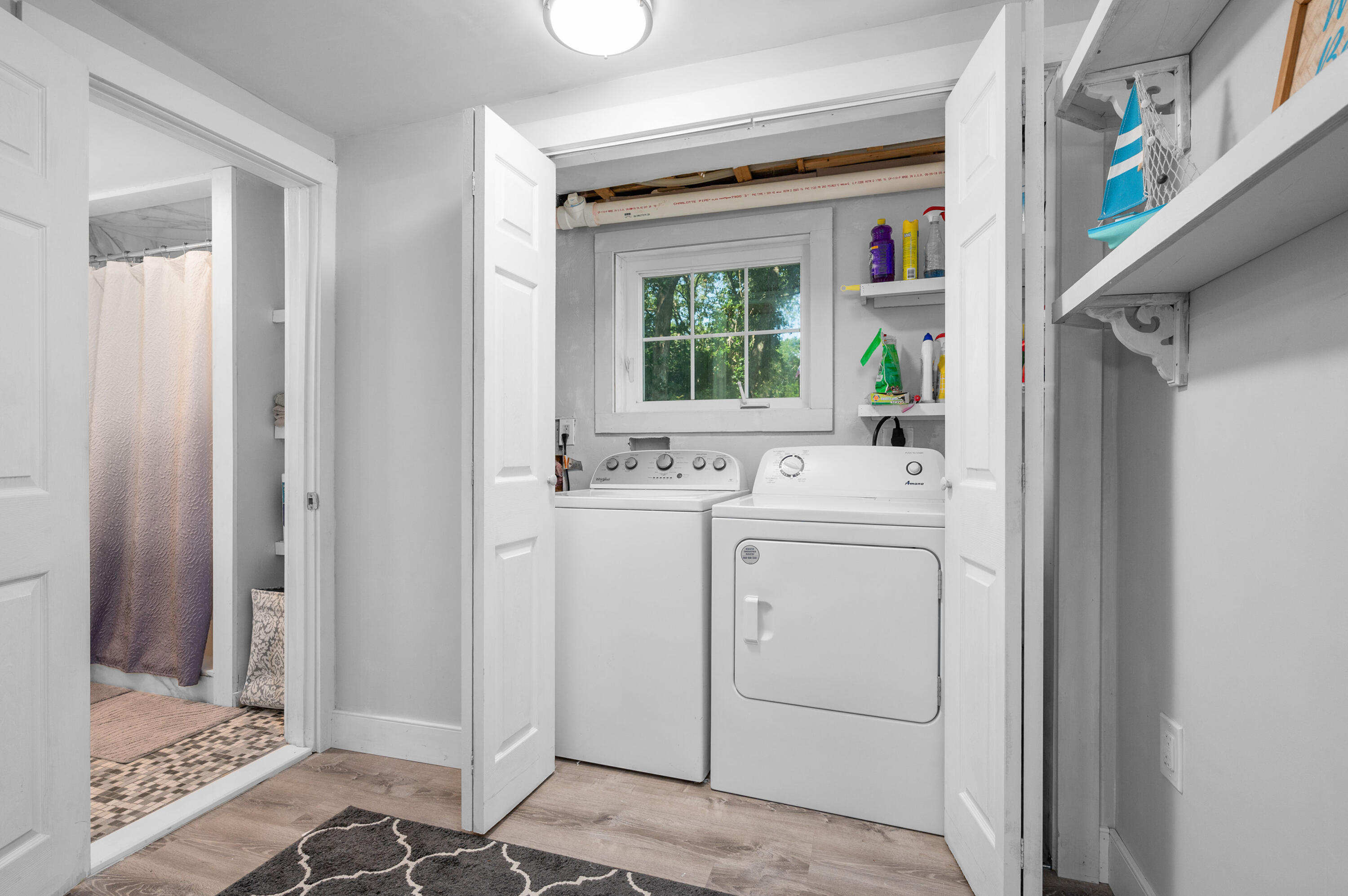 36 Riverside Road Mashpee, MA 02649 - Photo 17 of 48 a bathroom with a sink a mirror and a window