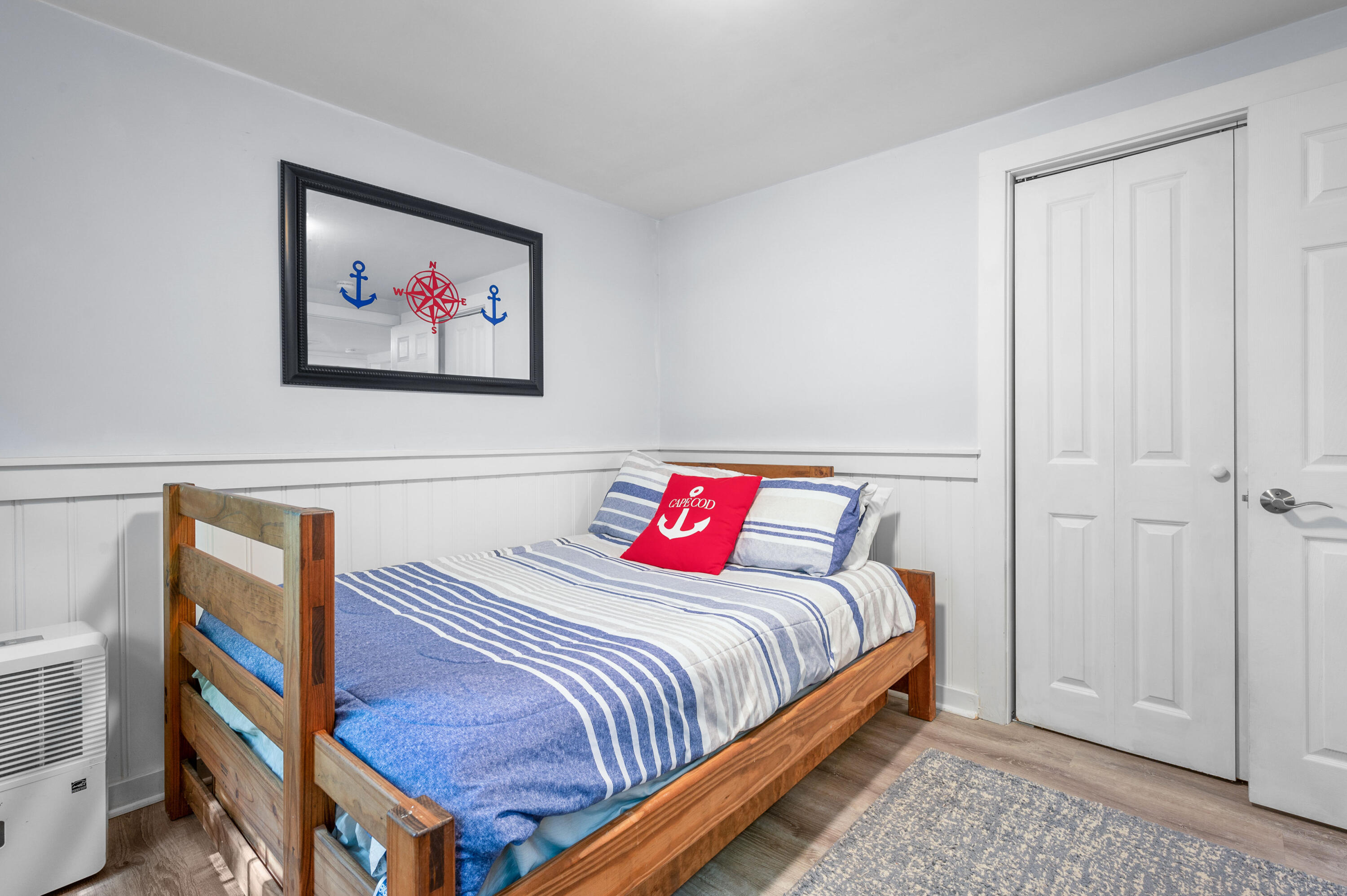 36 Riverside Road Mashpee, MA 02649 - Photo 20 of 48 a bedroom with bed and a painting on the wall
