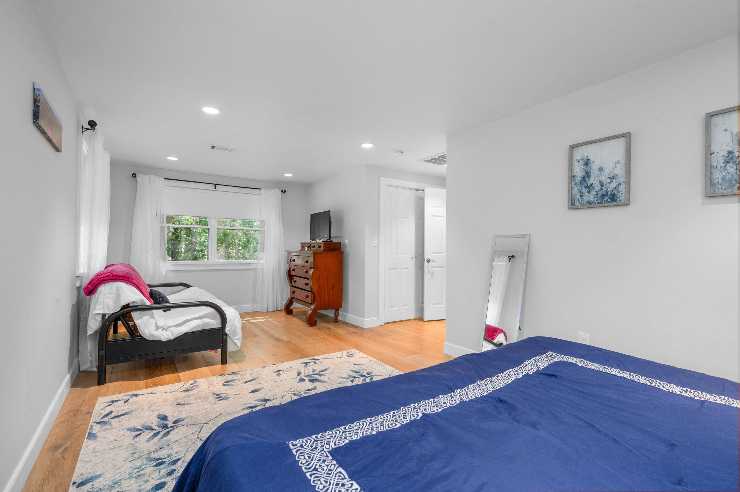 36 Riverside Road Mashpee, MA 02649 - Photo 25 of 48 a bed room with a bed and a chair