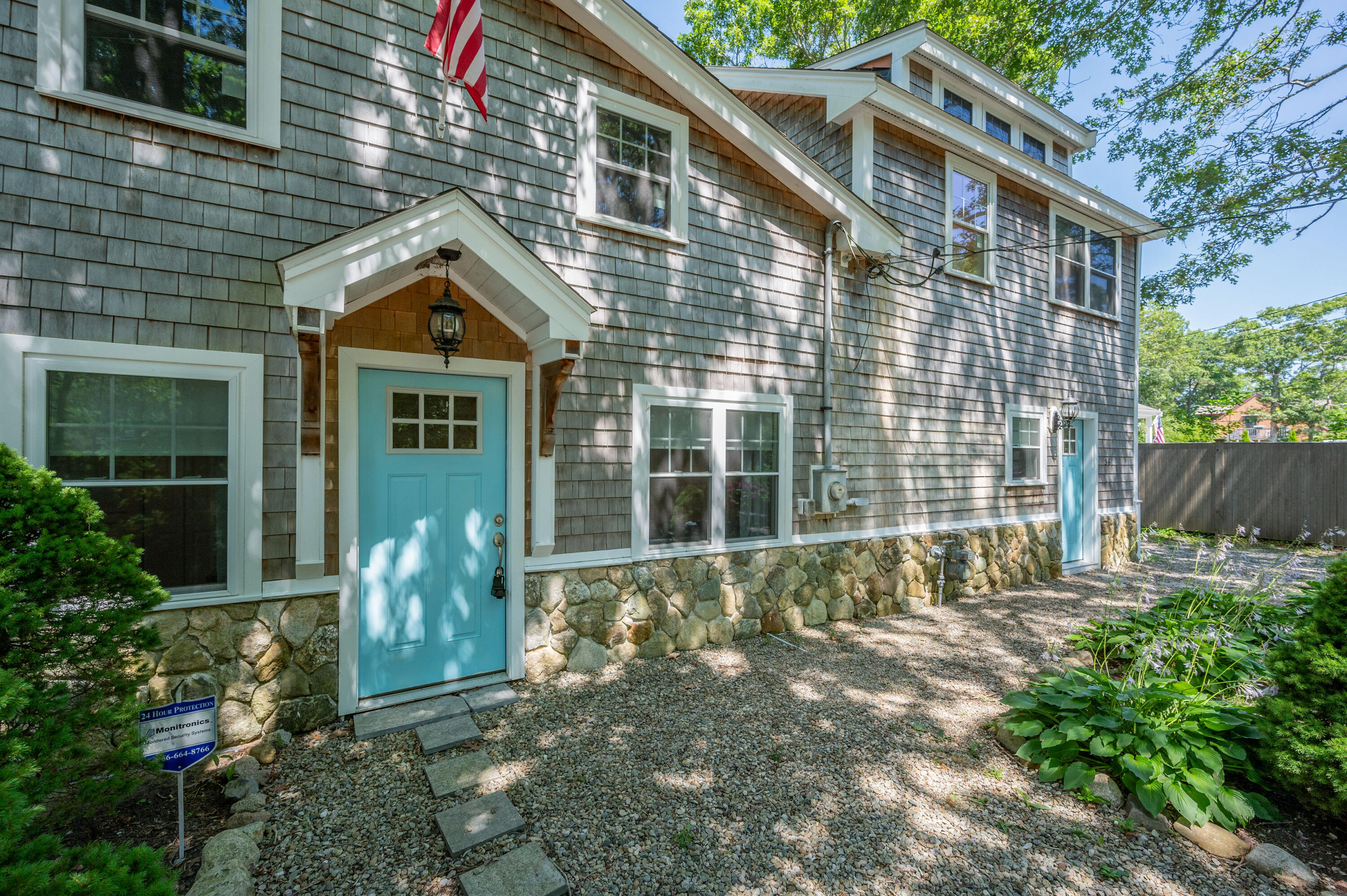 36 Riverside Road Mashpee, MA 02649 - Photo 3 of 48 a front view of a house with a yard