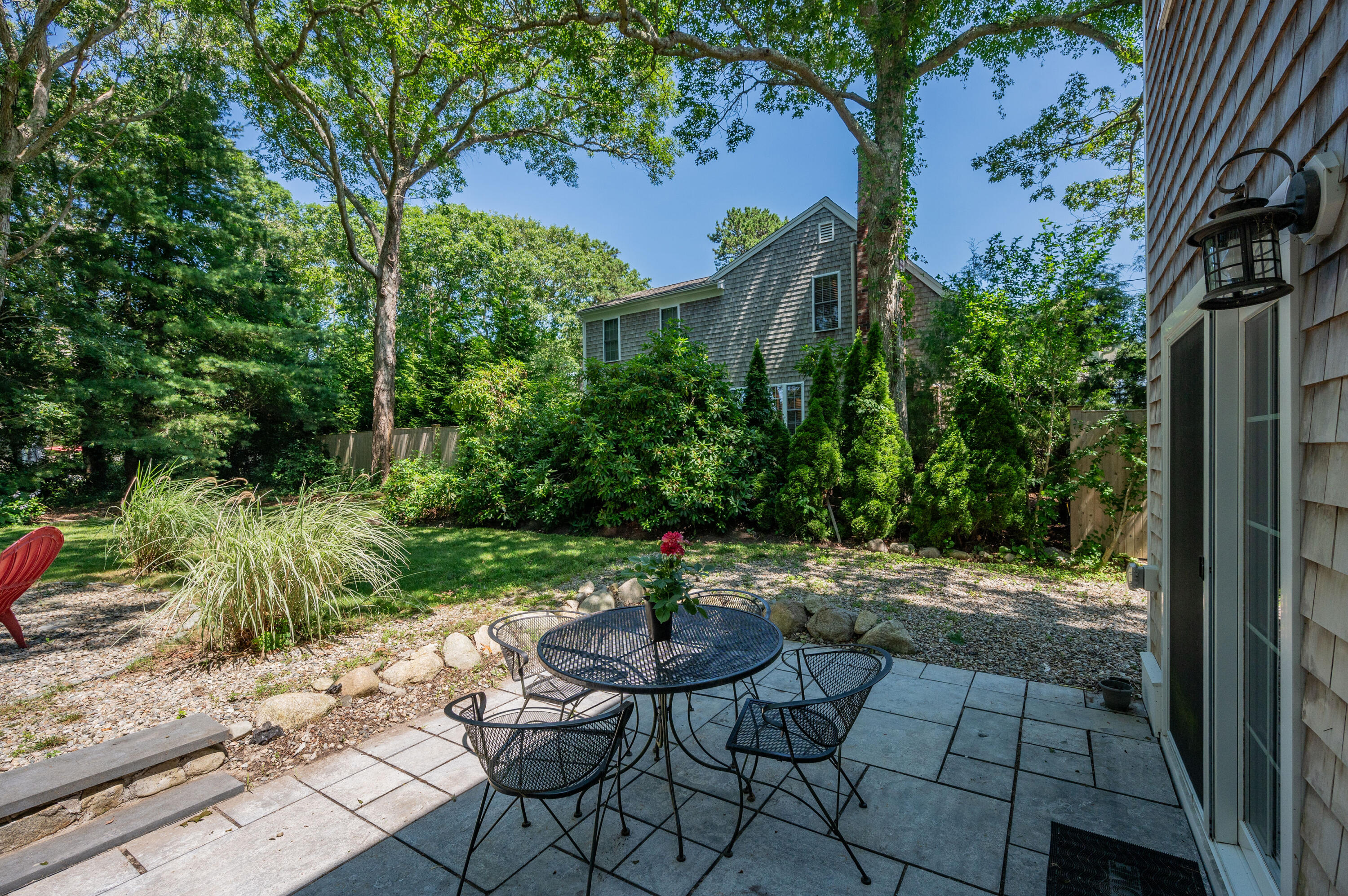 36 Riverside Road Mashpee, MA 02649 - Photo 36 of 48 a view of a backyard with sitting area