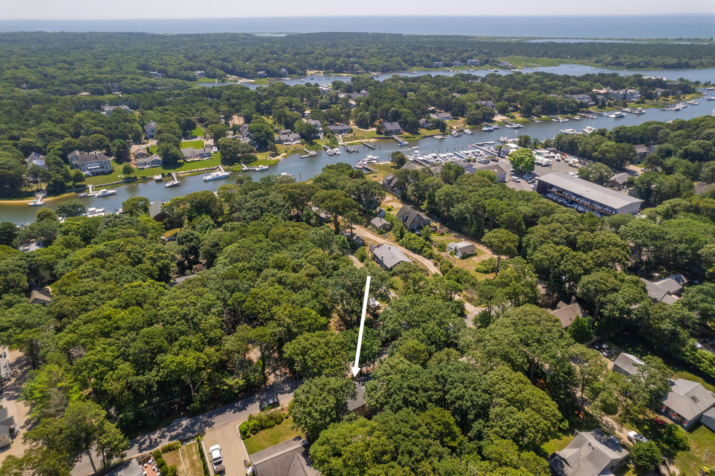 36 Riverside Road Mashpee, MA 02649 - Photo 41 of 48 an aerial view of residential houses with outdoor space and trees