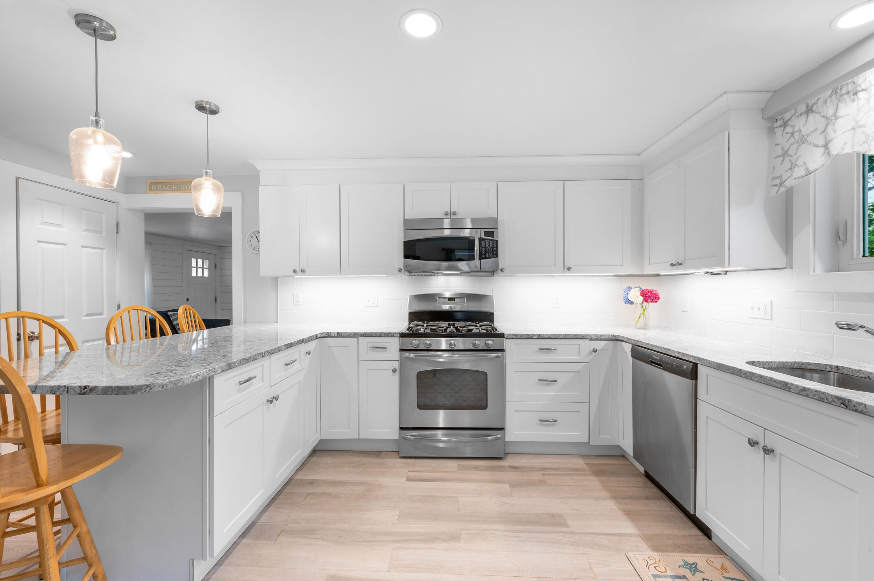 36 Riverside Road Mashpee, MA 02649 - Photo 9 of 48 a kitchen with granite countertop a sink stainless steel appliances and cabinets
