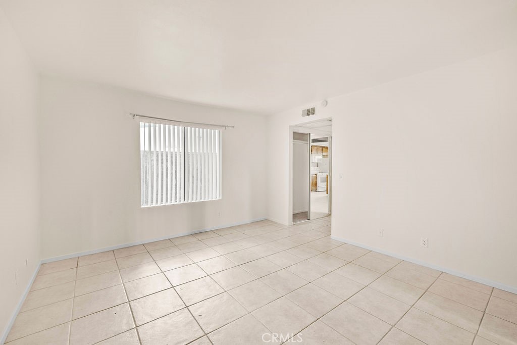 1735 East Washington Street, Unit F14 Colton, CA 92324 - Photo 16 of 26 an empty room with windows