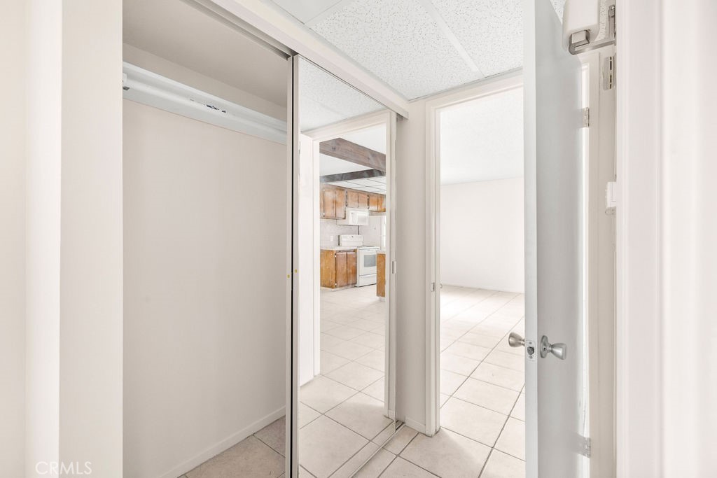 1735 East Washington Street, Unit F14 Colton, CA 92324 - Photo 17 of 26 a view of a bathroom with a glass shower door