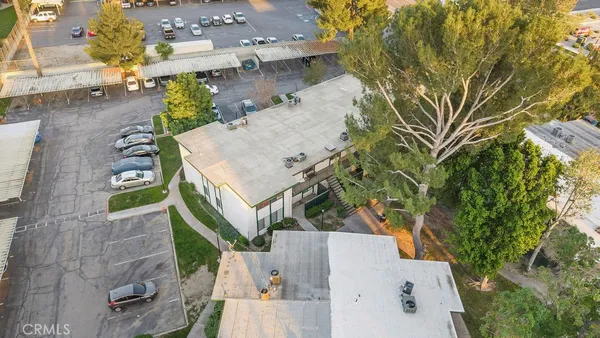 an aerial view of a house with a yard