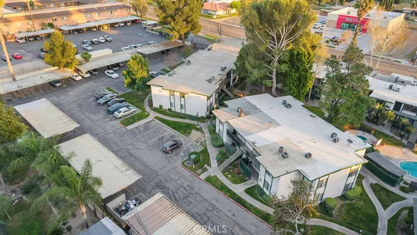 an aerial view of residential houses with outdoor space