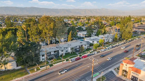 an aerial view of a house with a swimming pool